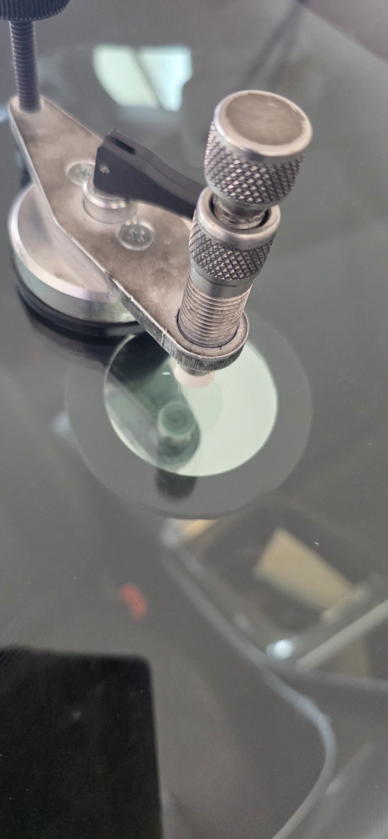 Resin injector seated and sealed on a windshield chip