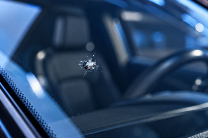 Small windshield rock chip damage before professional repair